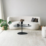 Table basse design organique en verre teinté Torpo - cadre en métal noir 
