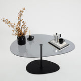 Table basse design organique en verre teinté Torpo - cadre en métal noir 